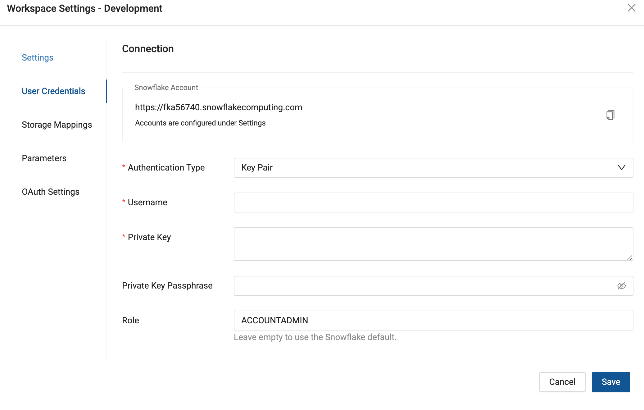 Workspace Settings Development page showing Snowflake connection configuration. Left sidebar lists Settings, User Credentials, Storage Mappings, Parameters, and OAuth Settings. Main panel displays connection details including Snowflake account URL (fka56740.snowflakecomputing.com), authentication fields for Key Pair login, and role set to ACCOUNTADMIN. Cancel and Save buttons at bottom.